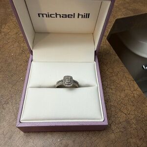 Michael hill, 
engagement ring + band 
10K white gold stamped inside the ring